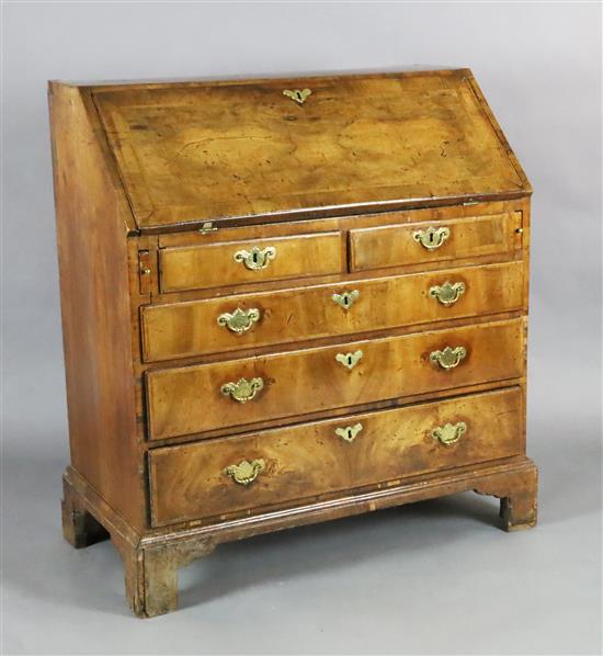 A George II walnut bureau, W.3ft 2in. D.1ft 8in. H.3ft 4.5in.